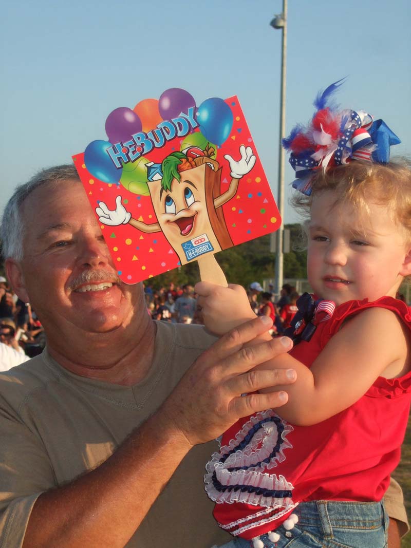 photo of man holding girl at the July 4, 2012 Concert and Fireworks Show